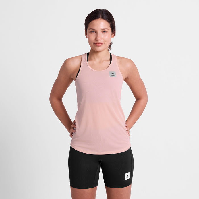 SAYSKY reactive flow pink singlet tank top for women, ultra-light, race tank, full body view of women wearing SAYSKY tank with black shorts