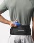 Man wearing Salomon High Point running belt that holds water flasks and other essentials