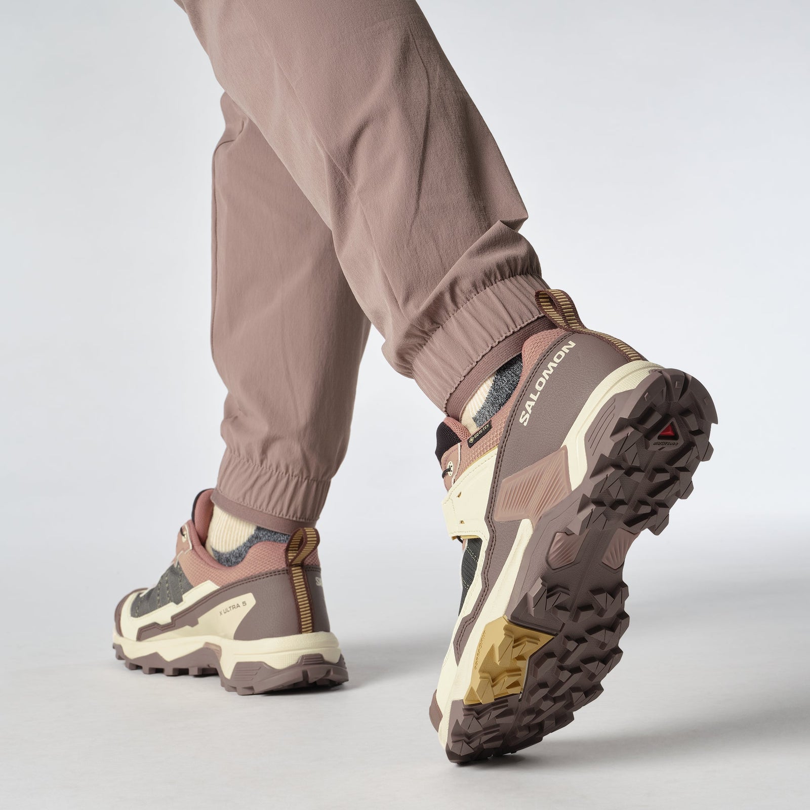 woman wearing Salomon X Ultra Goretex Hiking shoe in Burlwood / French Roast / Rattan colour