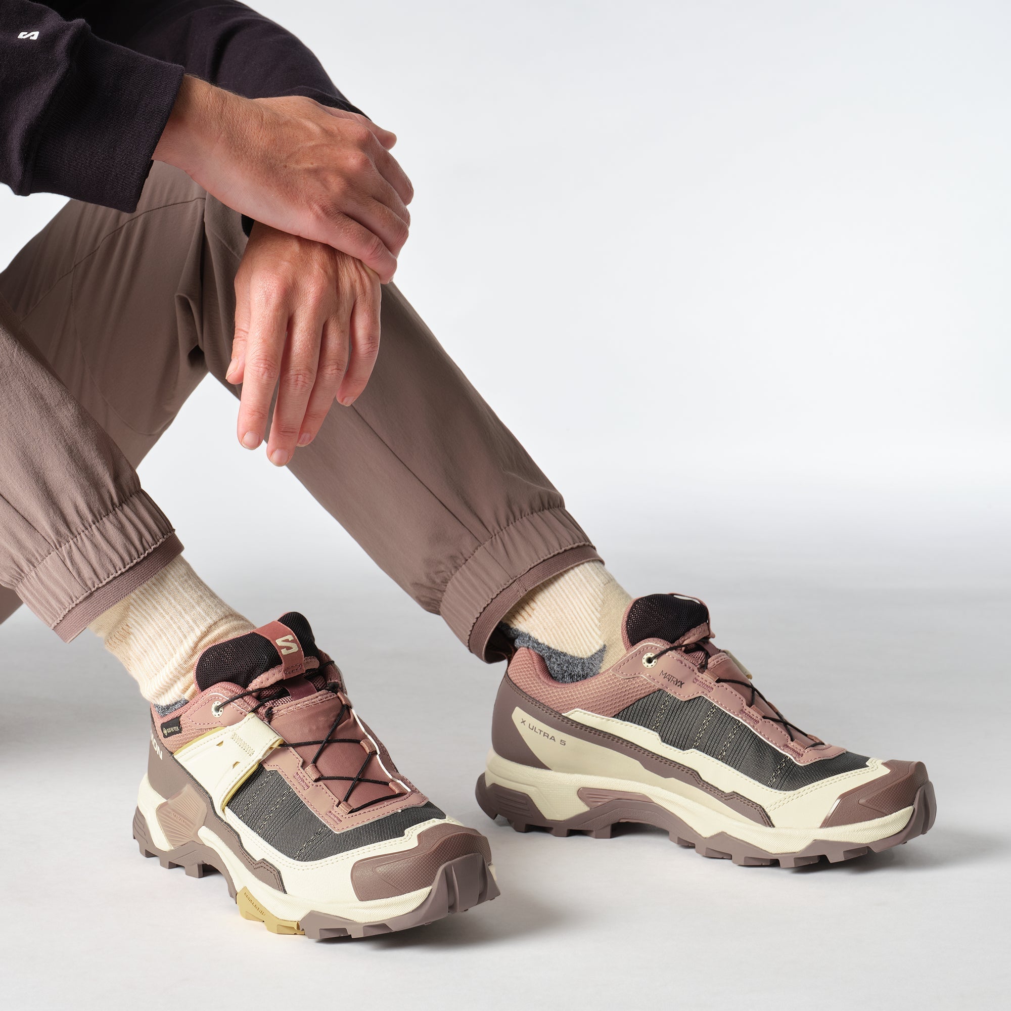 woman wearing Salomon X Ultra Goretex Hiking shoe in Burlwood / French Roast / Rattan colour