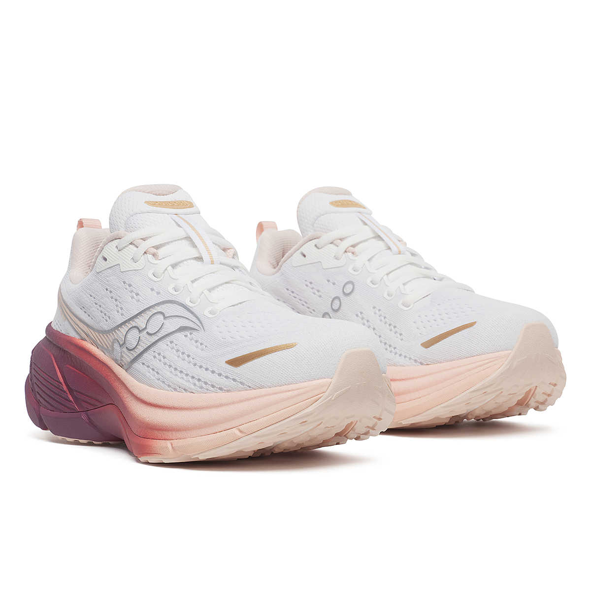 Pair of white saucony running shoe with pink sole
