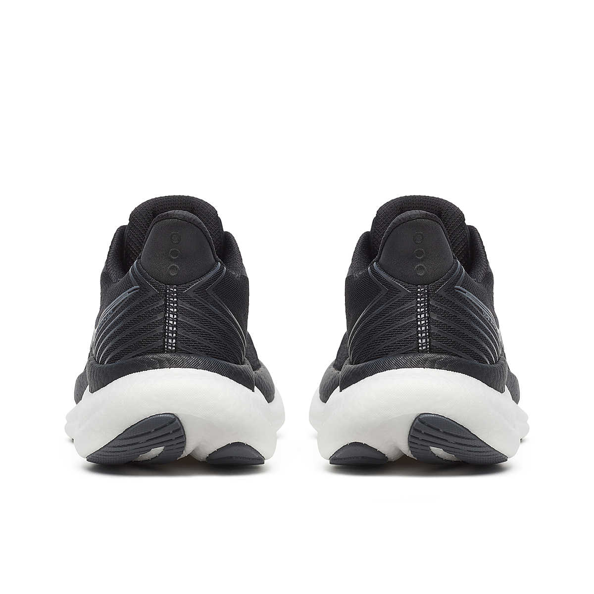 Pair of womens saucony triumph 23 running trainers shoes black white 