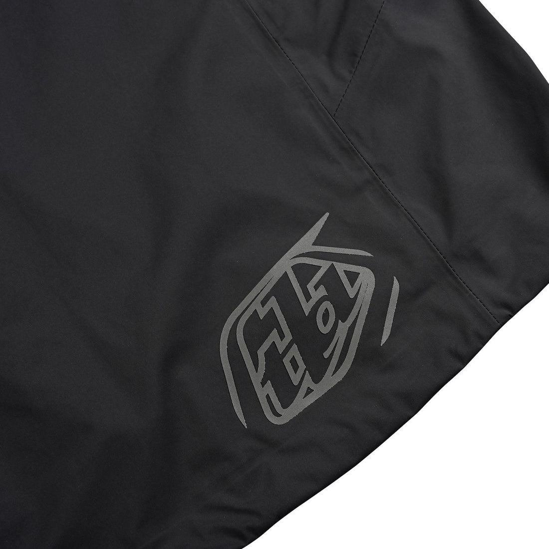 logo of black mono carbon troy lee designs resist mountain biking jacket