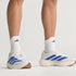 man wearing adidas adizero evo sl men's running shoe in white with blue stripes