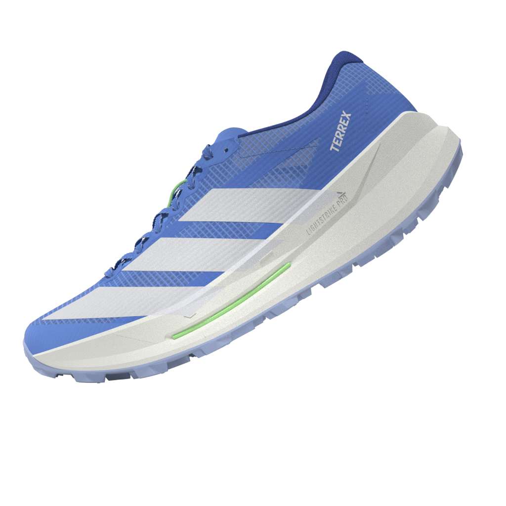 side view of adidas terrex agravic tt trail running shoe for women in blue with lime trim