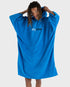 dryrobe organic cotton towel, towel changing robe for before and after swimming, cobalt blue colour, man wearing dryrobe towel pulling up the hood