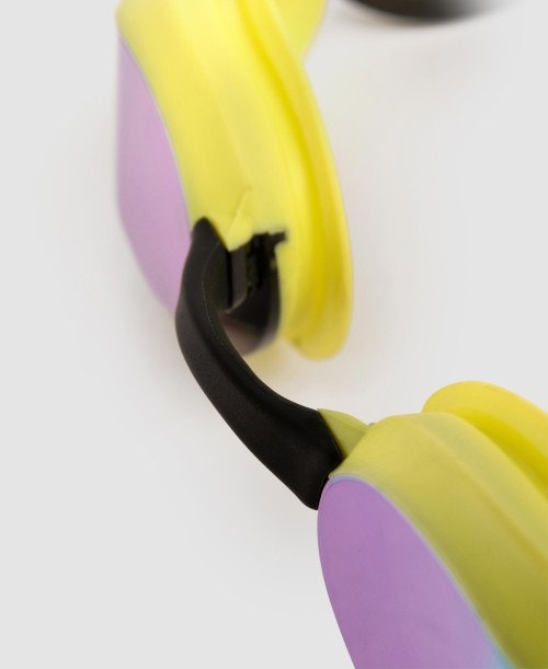 Close-up of arena cobra core goggles with yellow and purple frame