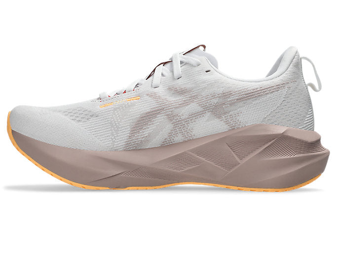pair of asics novablast 5 for women white and brown colour inside profile