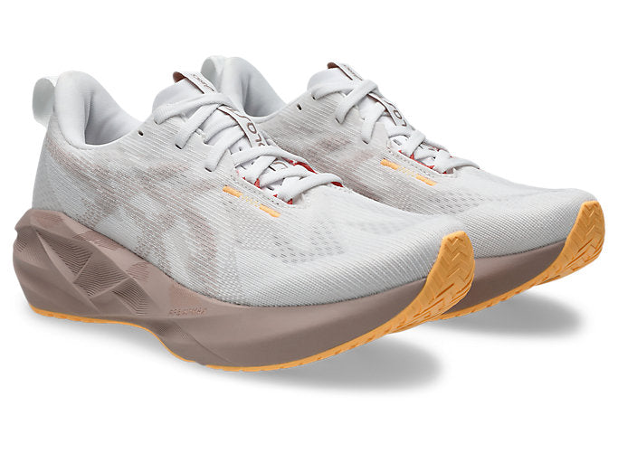 pair of asics novablast 5 for women white and brown colour