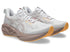 pair of asics novablast 5 for women white and brown colour