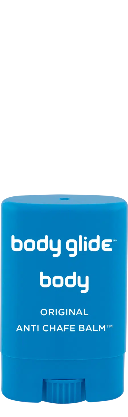 Blue stick of body glide anti-chafe balm on a white background