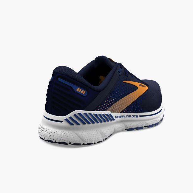 Navy brooks adrenaline gts 22 running shoe with orange accents on a white background