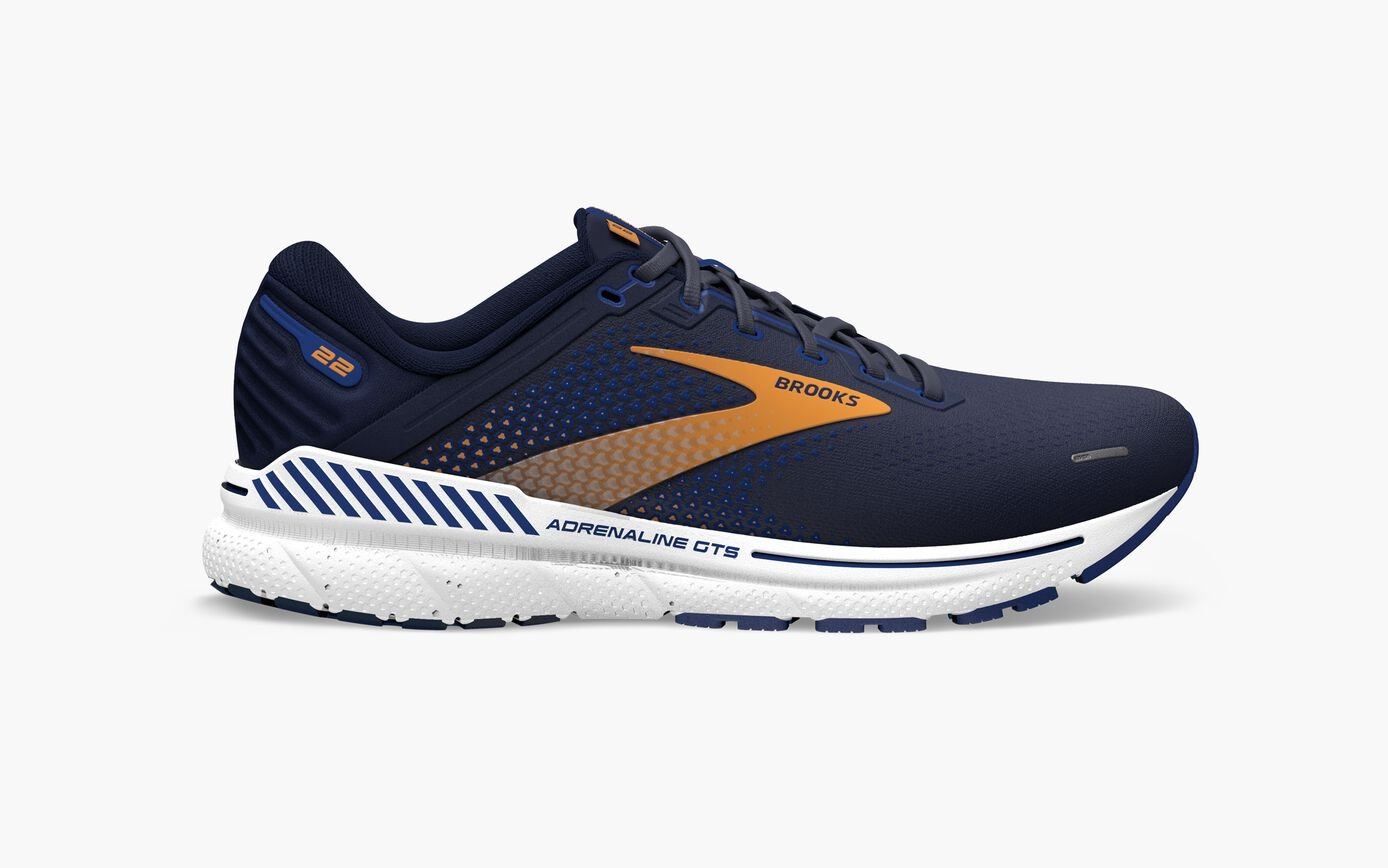 Navy brooks adrenaline gts 22 running shoe with orange accents on a white background
