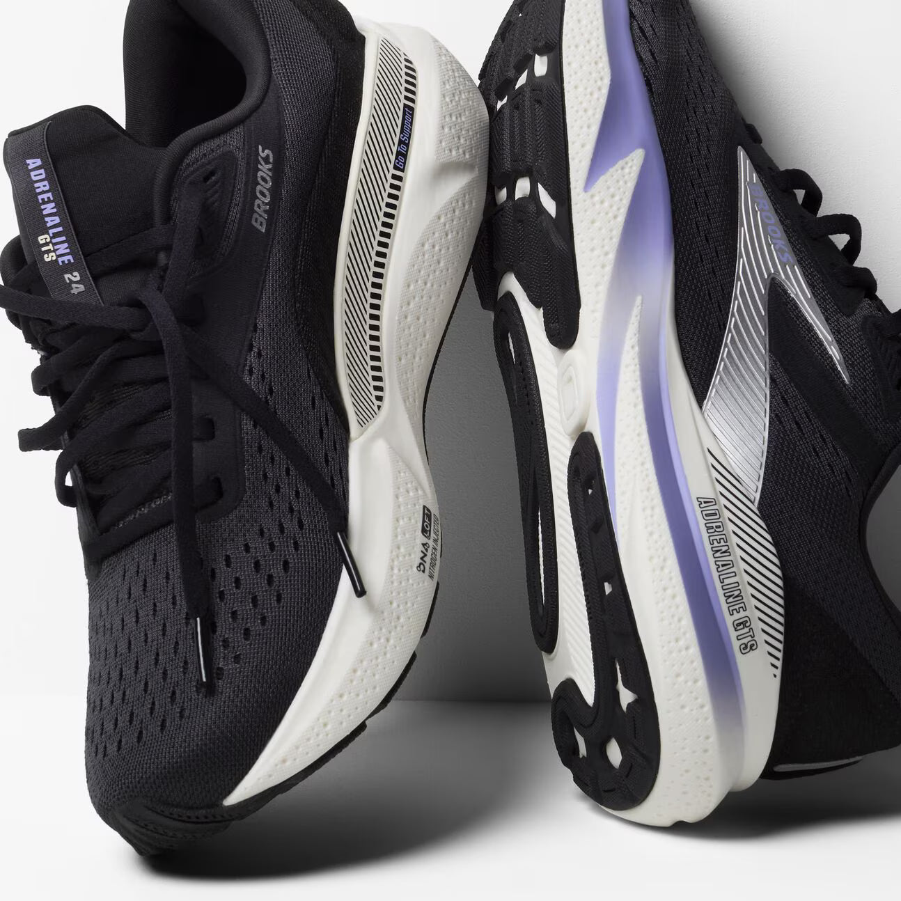 brooks adrenaline gts 24 womens, supportive running shoe, black with purple  details on white sole, pair of shoes side profiles with close up of sole and inside support