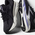 brooks adrenaline gts 24 for women, cushioned supportive running and walking shoe, black colour with silver logo white sole and purple details, pair of shoes angled against white wall with untied laces
