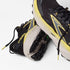 pair of brooks cascadia 19 for men, trail running and walking shoe, black with white sole and yellow details