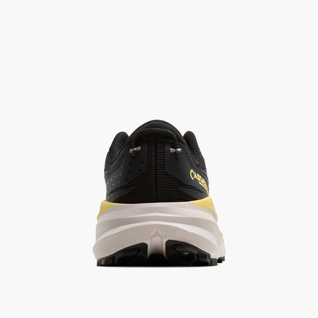 brooks cascadia 19 for men, trail running and walking shoe, black with white sole and yellow details, back view of shoe