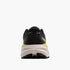brooks cascadia 19 for men, trail running and walking shoe, black with white sole and yellow details, back view of shoe