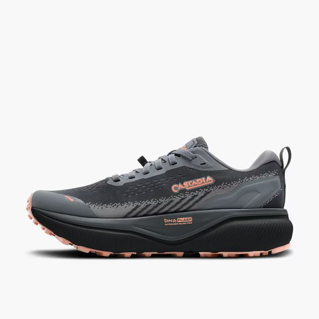 brooks cascadia 20 for women, road to trail gravel running and walking shoe, dark grey and black with peach detail, inside profile of shoe