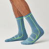 side view of brooks cascadia crew trail running socks in a blue colour with yellow accents and white brooks branding