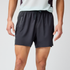 brooks cascadia short for men, lightweight running short for men with waist storage and zipper pockets, black colour, man wearing shorts with white top an dbackground