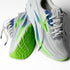 brooks ghost 17 for men road running shoe for everyday training white colour with white sole and blue and green details view of both shoes on each other