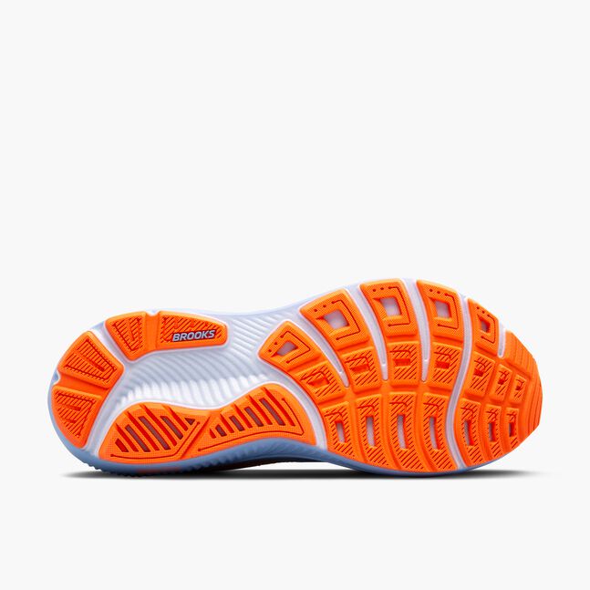 Orange and white running shoe sole with brooks ghost branding on a white background