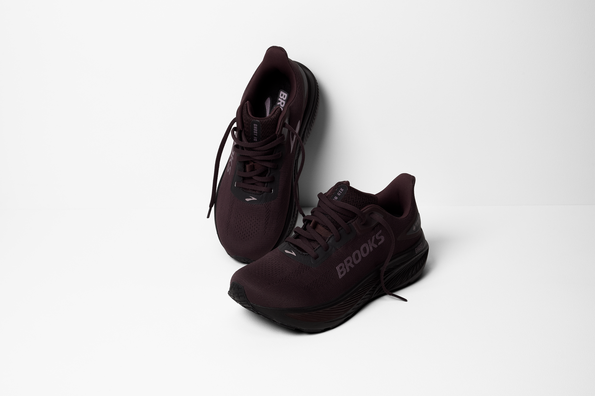 brooks ghost 18 gtx for women, waterproof everyday running and walking shoe, side profile of shoe, black with black sole, pair of shoes laces untied