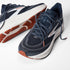 brooks ghost 18, road running and walking shoe for men, soft cushioning and balanced support, navy with white and brick red details, top and side of shoe with laces untied