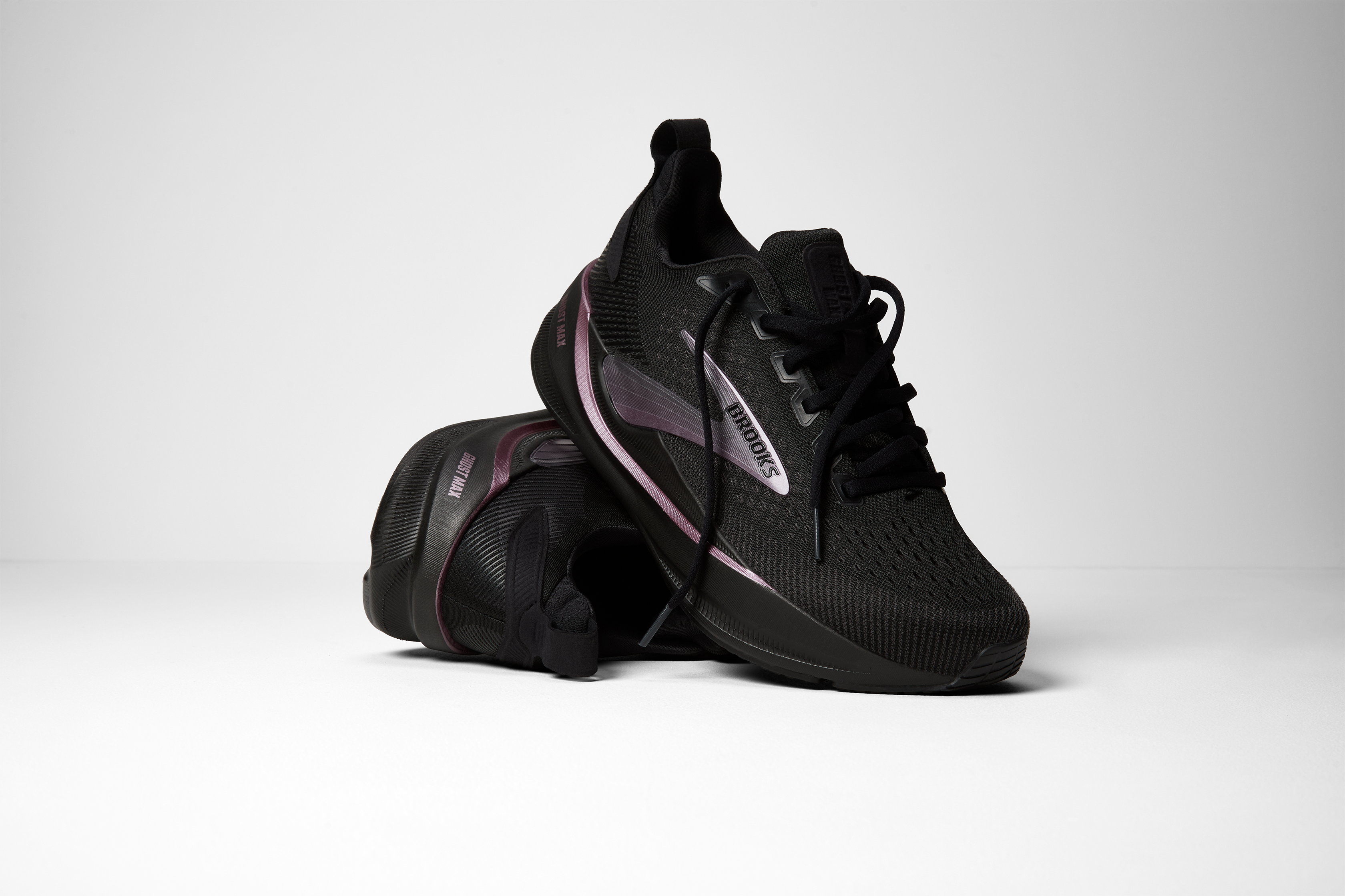 brooks ghost max 4 womens, maximum cushioned road running and walking shoe, black with shiny dark purple details,  pair of shoes
