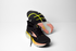 brooks glycerin 23 women, maximum cushioned road running and walking shoe, black with yellow and peach details, pair of shoes with laces untied and one overturned