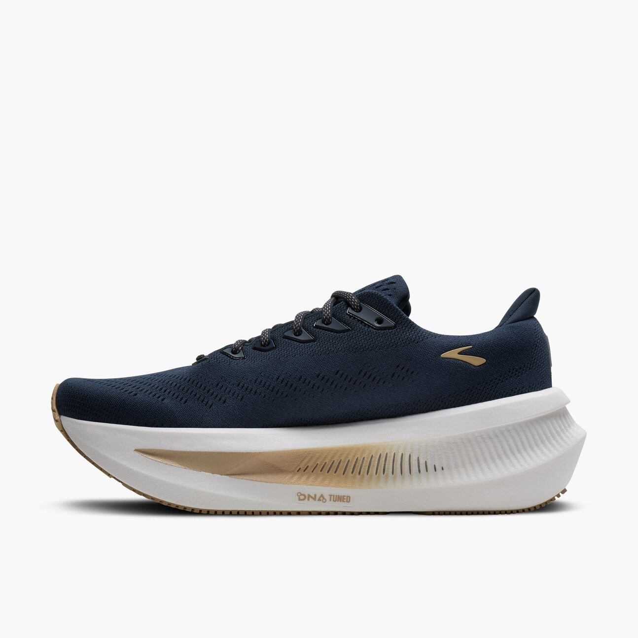 brooks glycerin max, bouncy, energetic, max cushioned daily trainer. navy upper with white sole and gold details. inside side view.