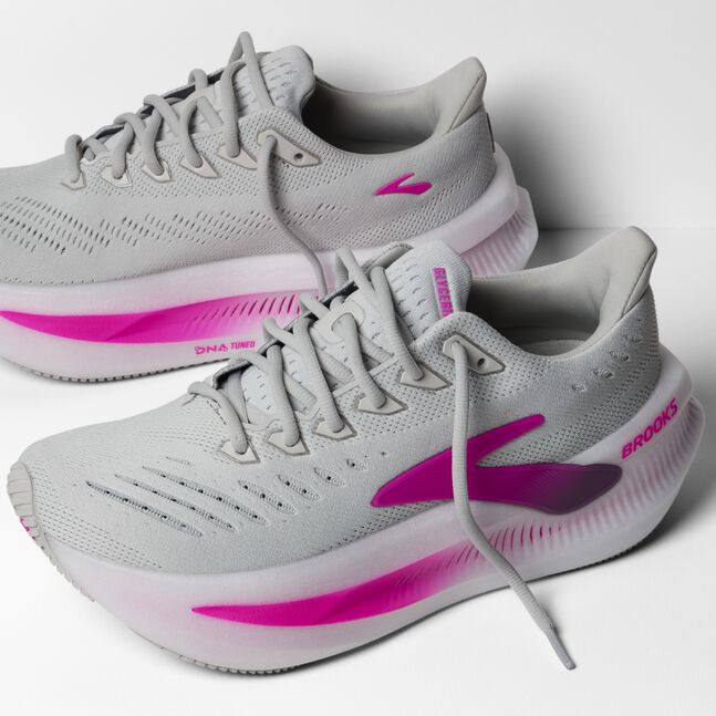 brooks glycerin max 2 for women, ultra cushioned running shoe for long distances and recovery runs, white and grey with pink details, pair of shoes outside and inside profile with laces untied