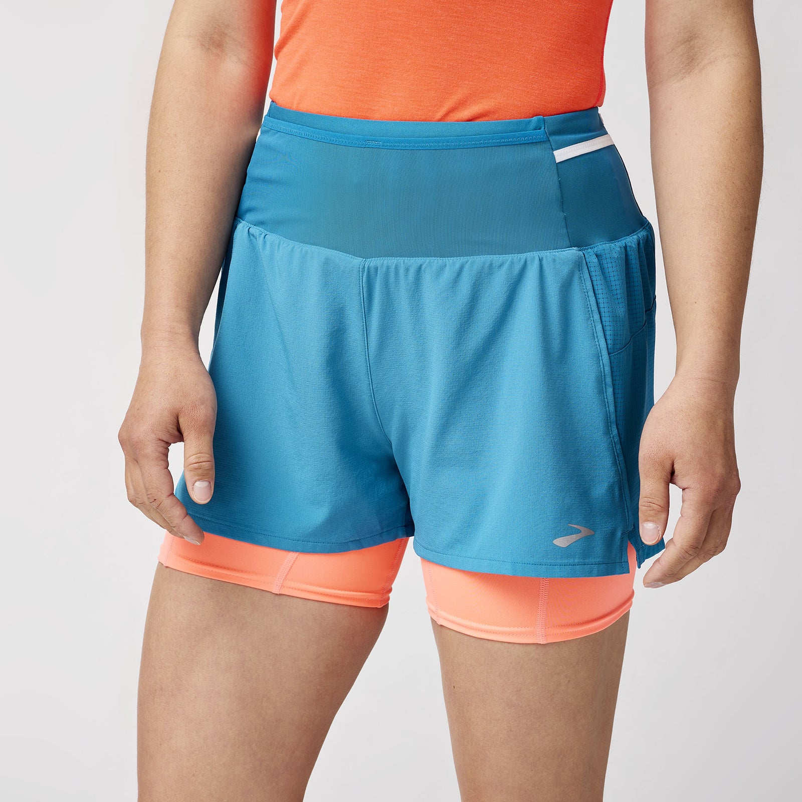 Brooks High Point Women's Trail Shorts with pockets and storage, blue and orange colour