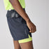 Man wearing Brooks High Point 2in1 trail shorts for men black and yellow colour