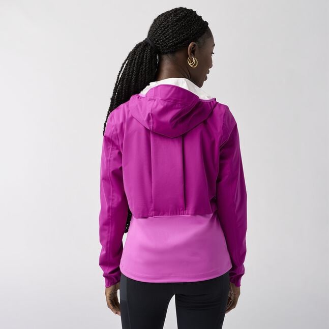 Woman wearing brooks high point waterproof running jacket purple, dark fuchsia 