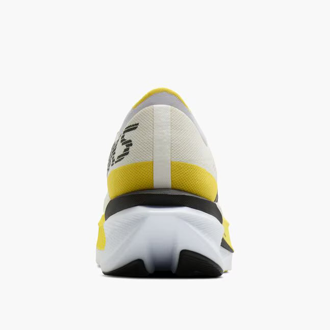 Back view of brooks hyperion max cushioning road running shoe in a white and yellow colour
