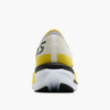 Back view of brooks hyperion max cushioning road running shoe in a white and yellow colour