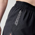 woman wearing brooks cascadia running short, lightweight women's trail-running shorts, black with white logo, close up of logo