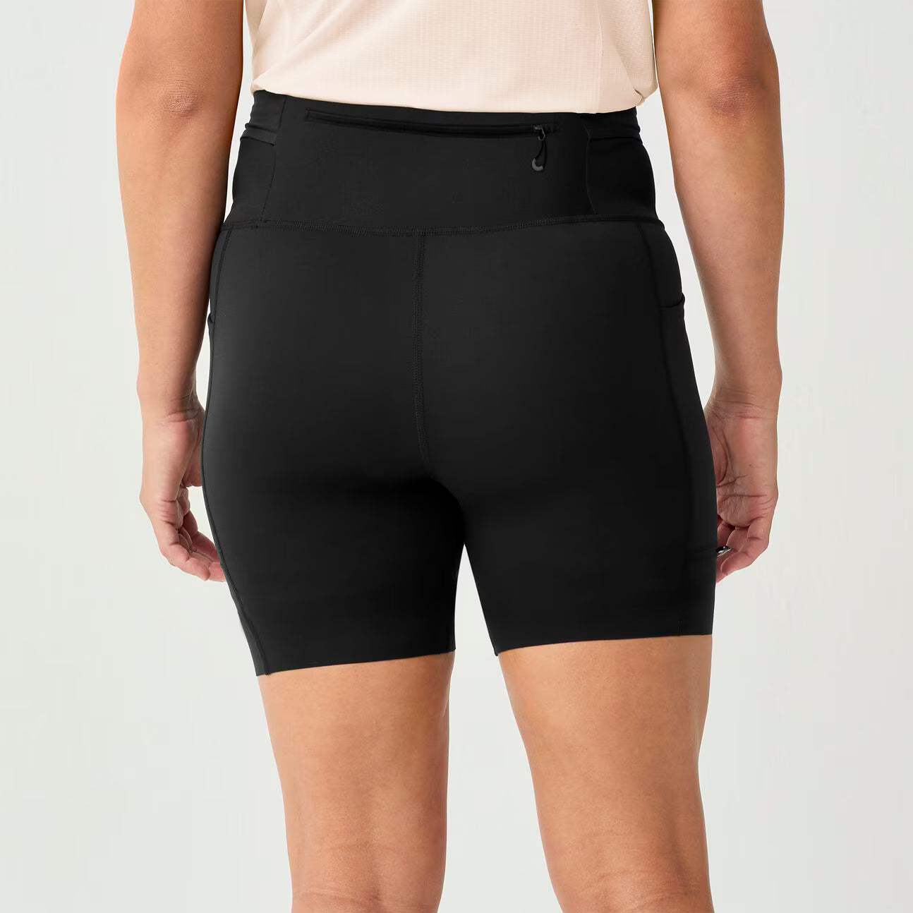 brooks cascadia short tight, 6" fitted running shorts for women, black colour, back profile of woman wearing brooks short on a white background