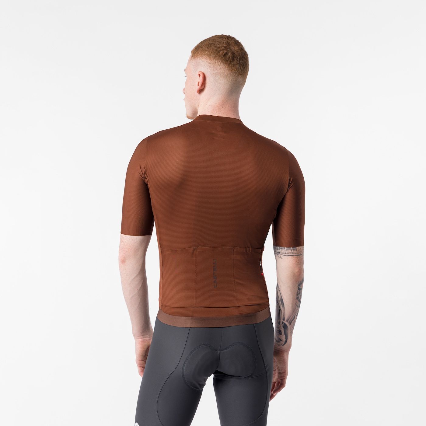 man wearing castelli espresso 2 jersey, showing back, mocha colour