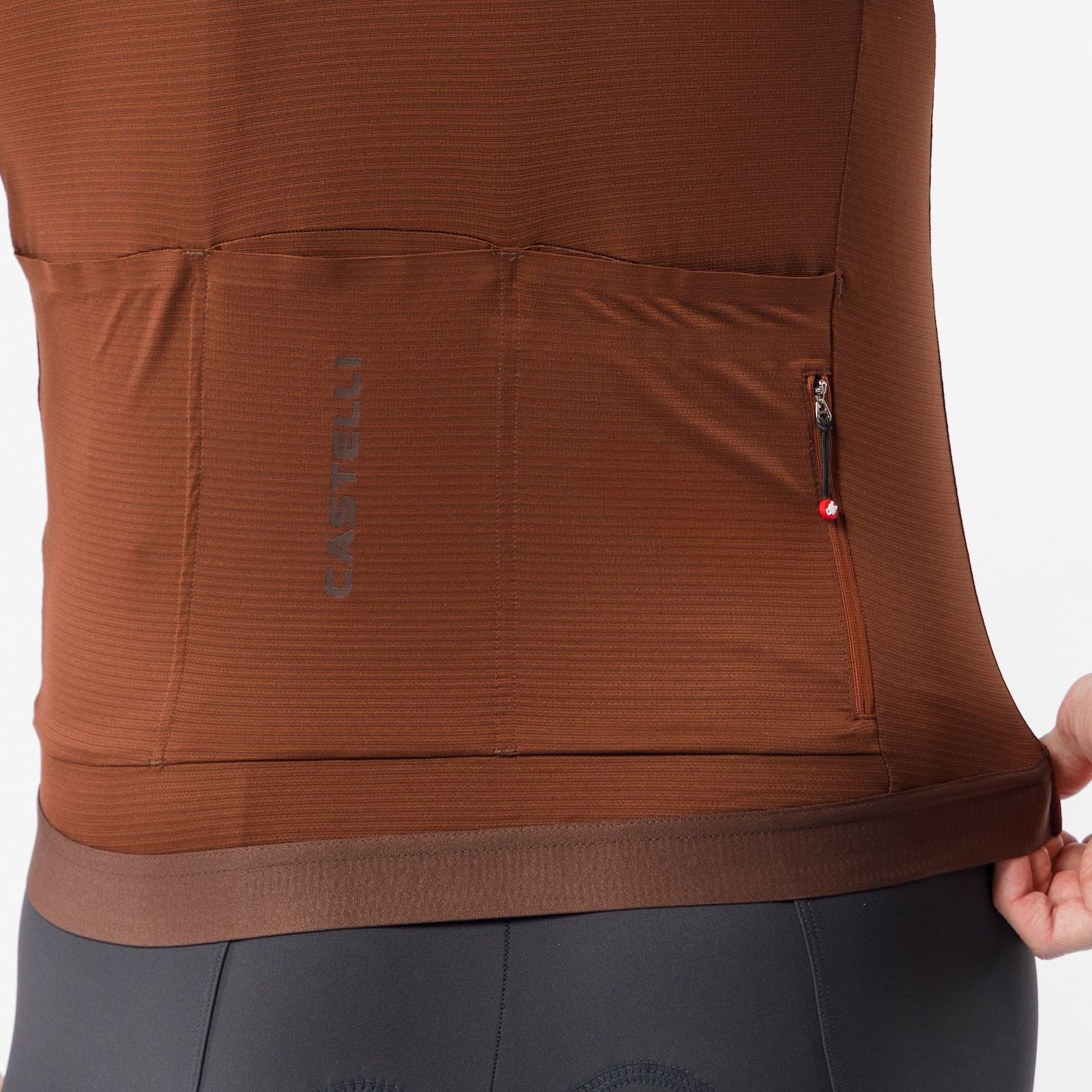 close up of back pockets on castelli espresso 2 jersey, showing logo, mocha colour