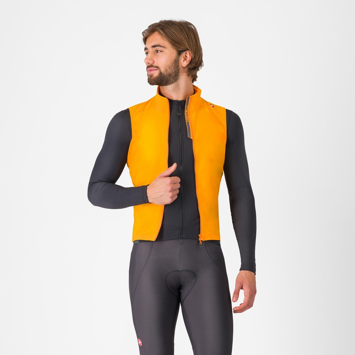 castelli espresso vest for men, full zip cycling vest, bright orange colour, man wearing cycling vest zipped open