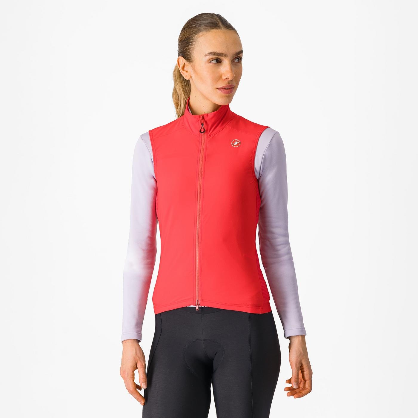 Woman wearing a Castelli Espresso Vest in hibiscus red, showing front