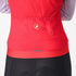 Woman wearing a Castelli Espresso Vest in hibiscus red, showing pockets at back