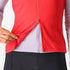 Woman wearing a Castelli Espresso Vest in hibiscus red, showing zip