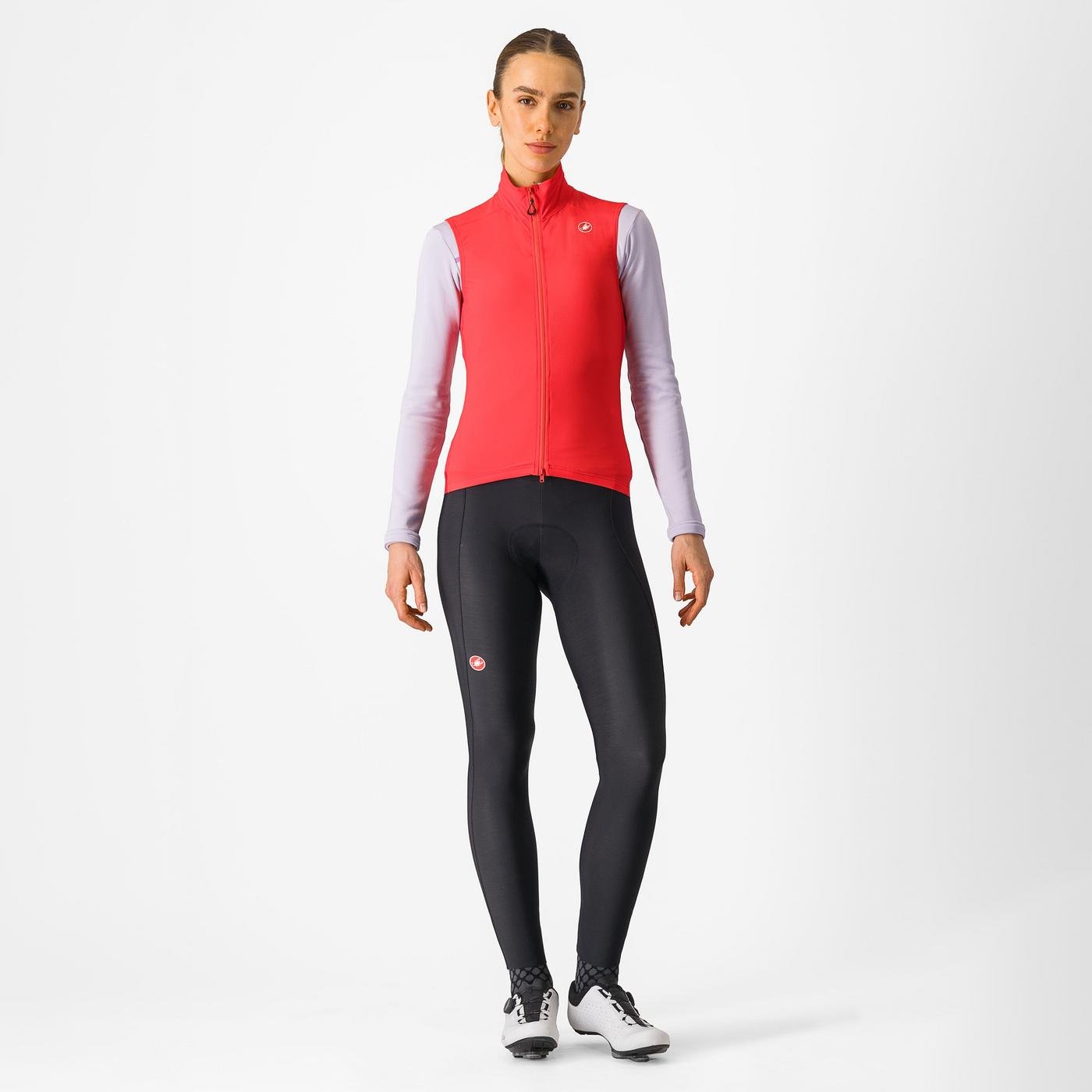 Woman wearing a Castelli Espresso Vest in hibiscus red