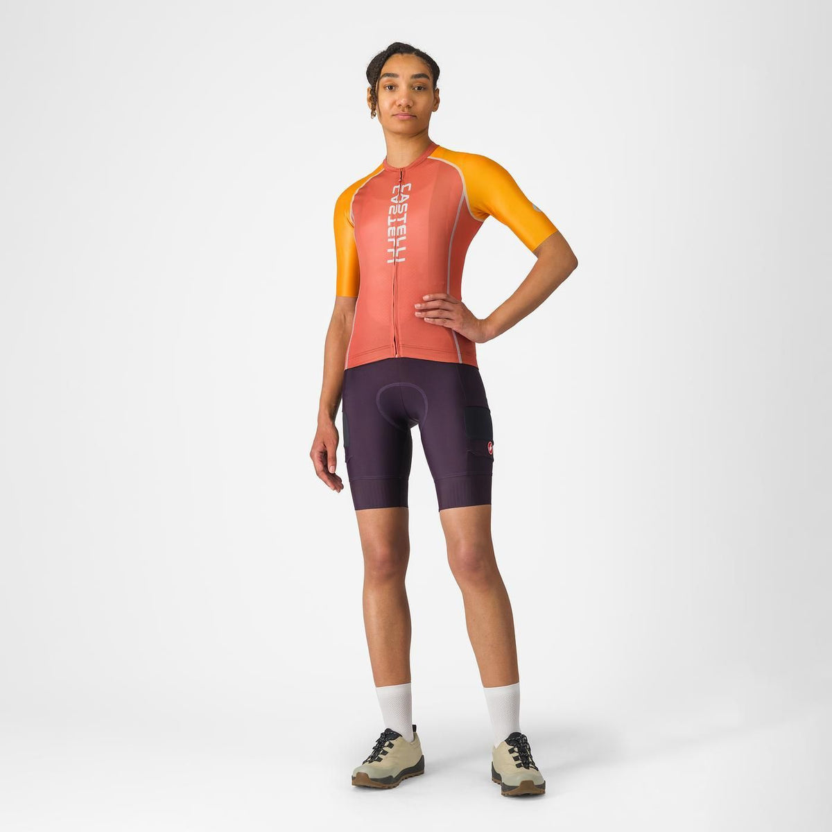 Castelli Unlimited 2 W Jersey, lightweight breathable womans cycling top, peach orange with bright orange sleeves and white details, woman wearing cycling top front profile