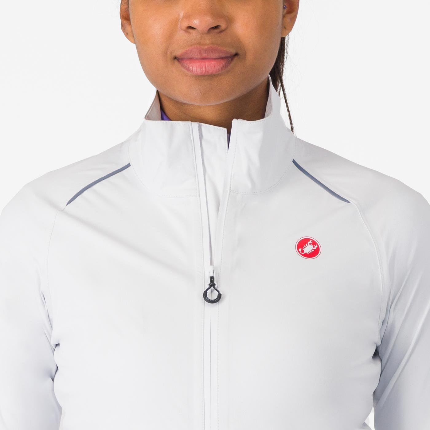 woman wearing castelli emergency 3 waterproof cycling jacket in white, showing collar and zip