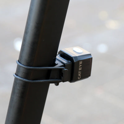 cateye nano 60, small square rear bike light, black cube bike light, close up of bike light strap